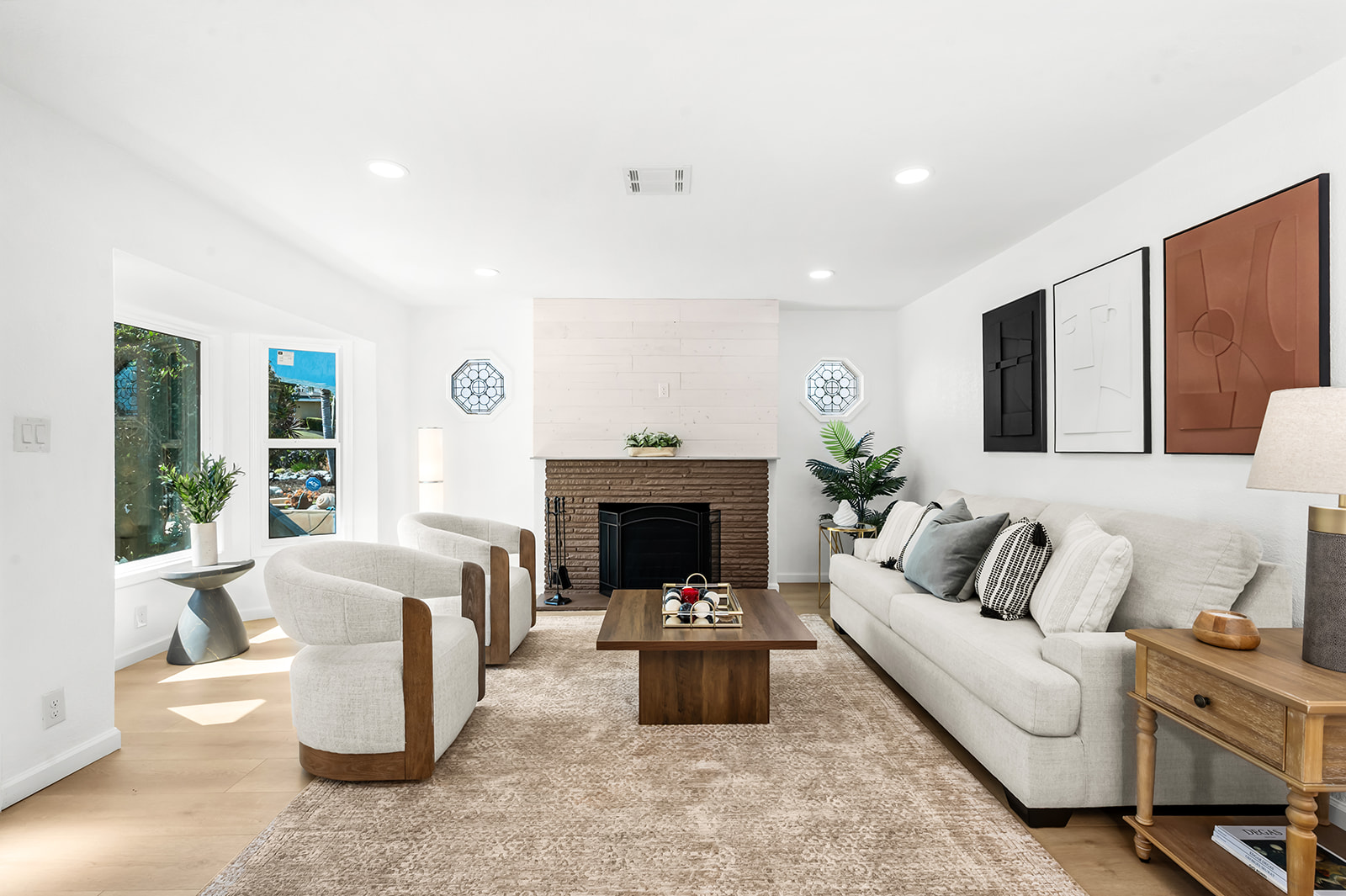 Living room with preserved brick fireplace and stained-glass windows